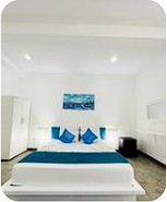 Cozy King Bedroom with Coastal Artwork